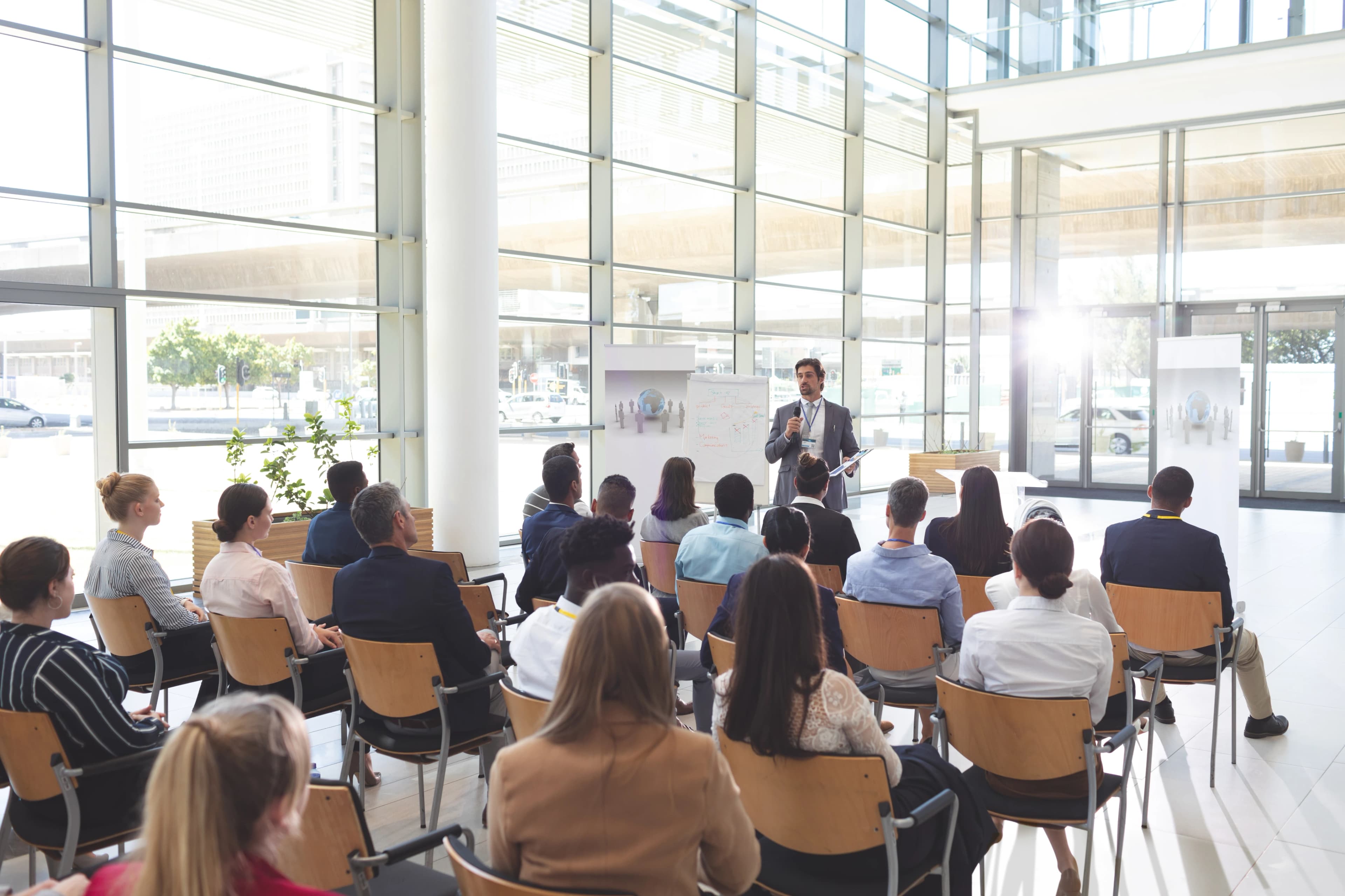 Professional business conference setup with stage and seating arrangement