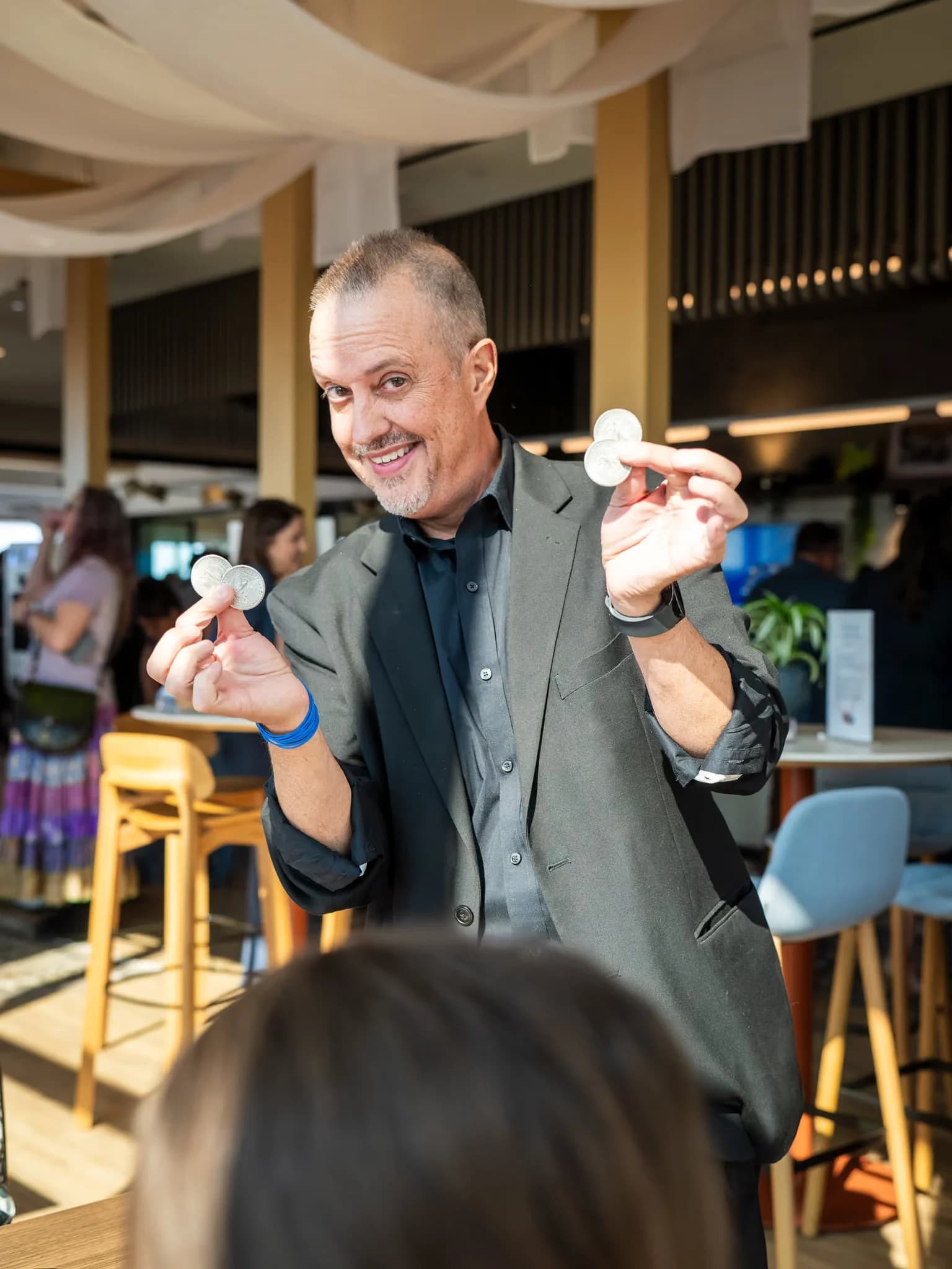 Magicreations comedy magician performing magic tricks for an audience