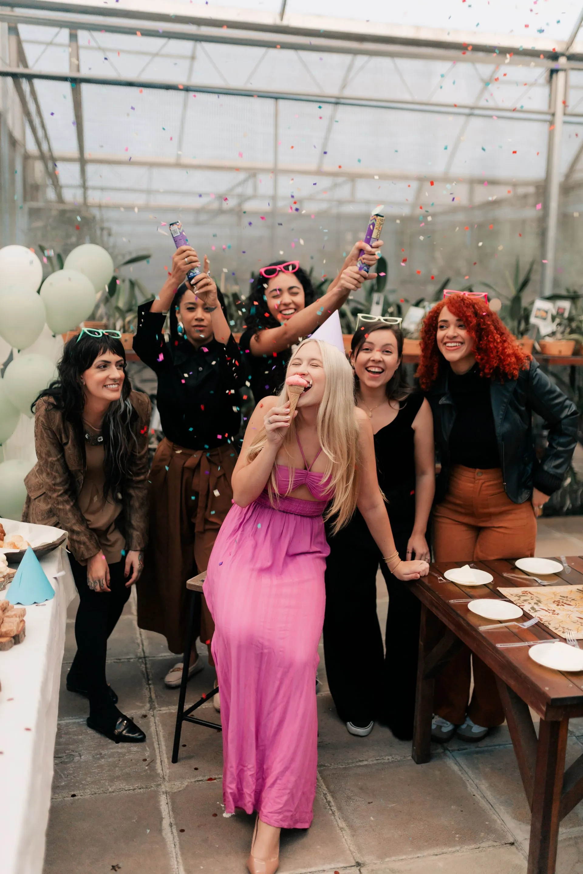 Party guests enjoying food and drinks at a celebratory gathering